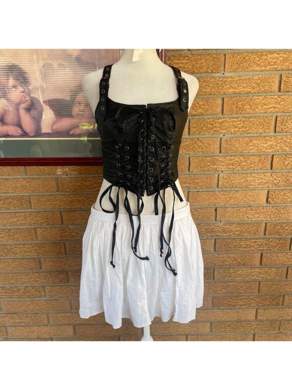 Widow black corset top with lace-up front and adjustable straps